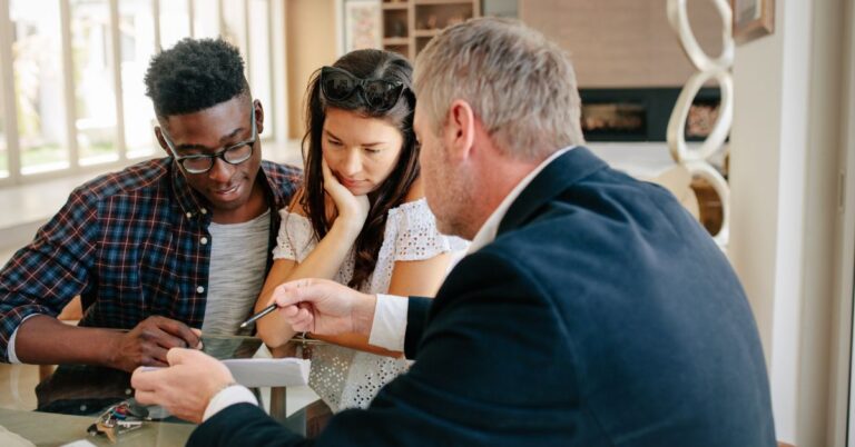 Young couple applying for a mortgage loan with a mortgage broker