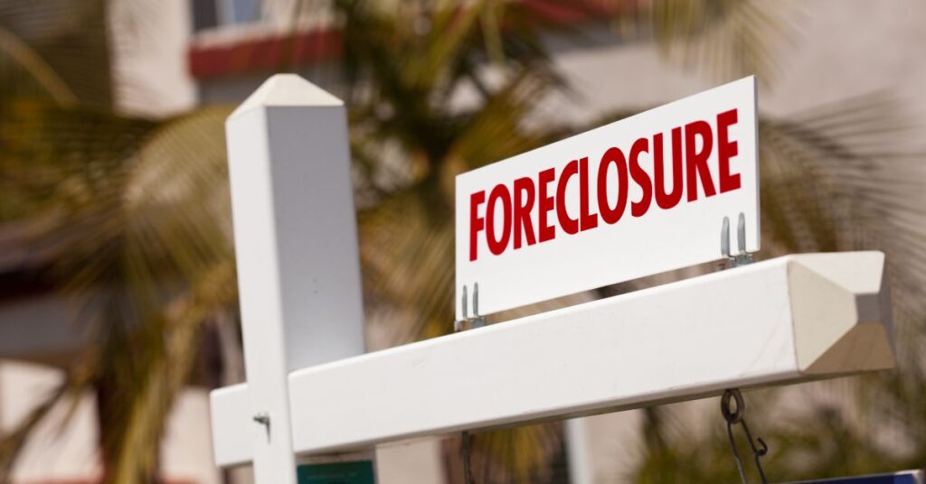 Foreclosures dip monthly in April but climb annually as housing strains persist.