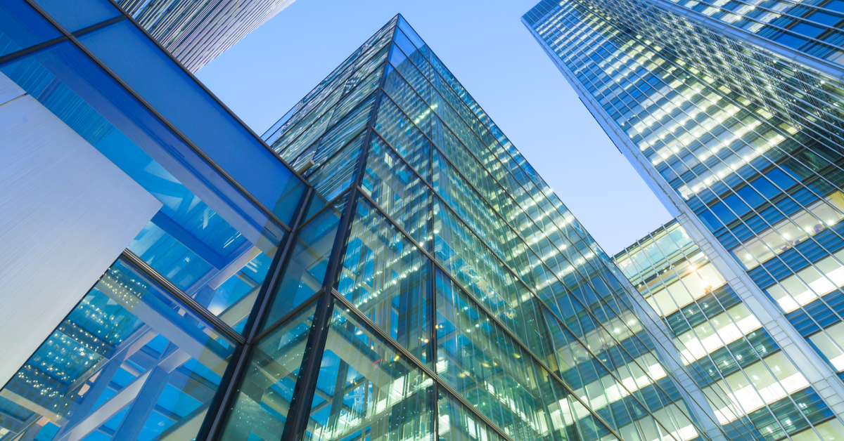 OFFICE Blue-tinted worm's eye view of skycrapers