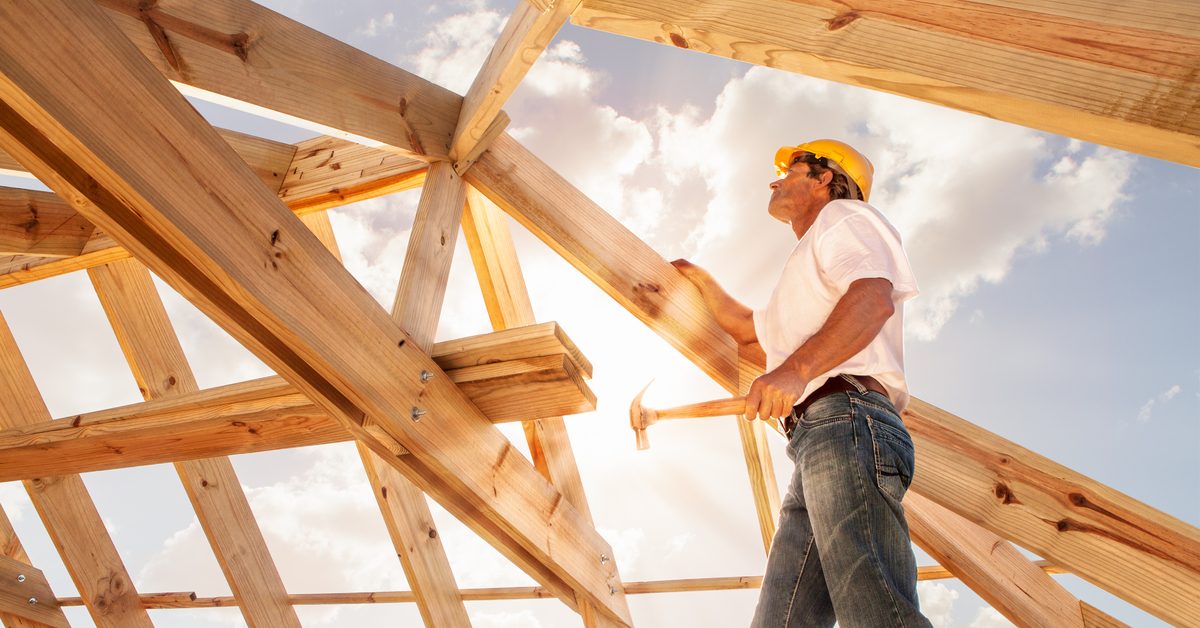 CONSTRUCTION Worker building a house
