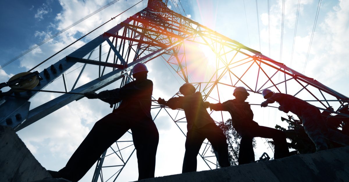 Silhouette of workers at construction site