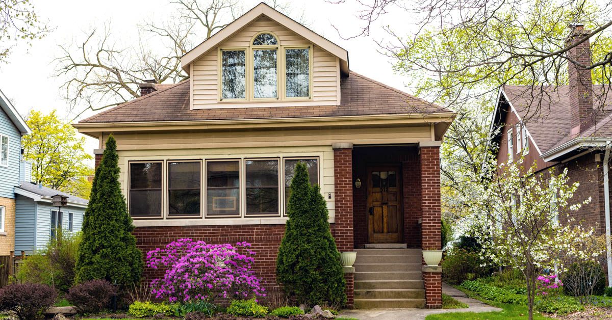 HOUSE Brick cottage house in suburban neighborhood