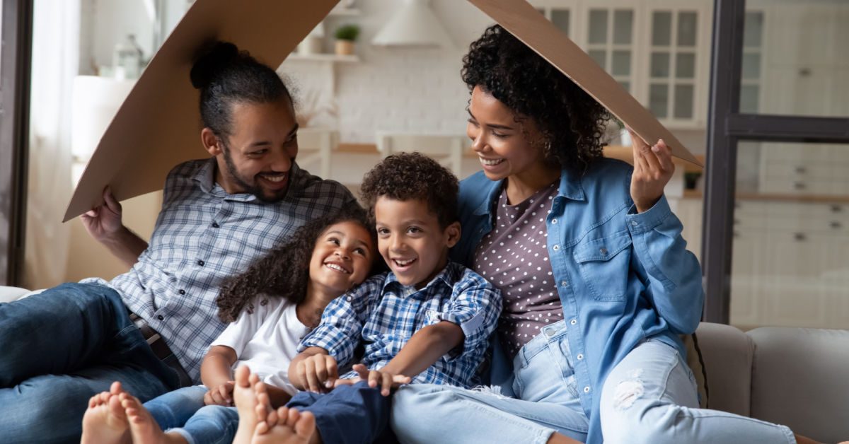 PEOPLE Young Black family relaxing in their home