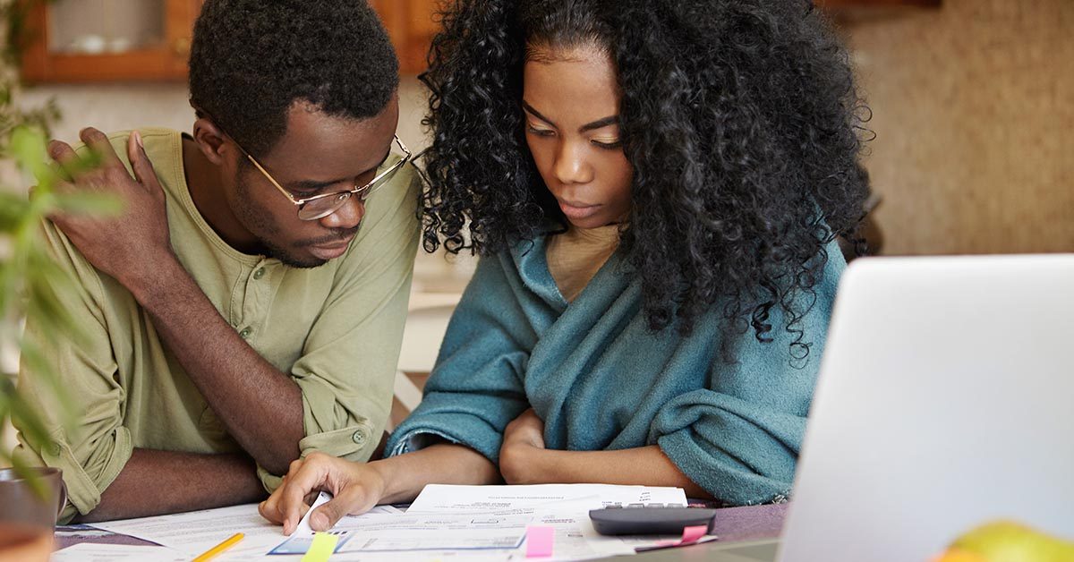 African,Couple,Reviewing,Their,Finances,,Analyzing,Family,Budget,,Thinking,How