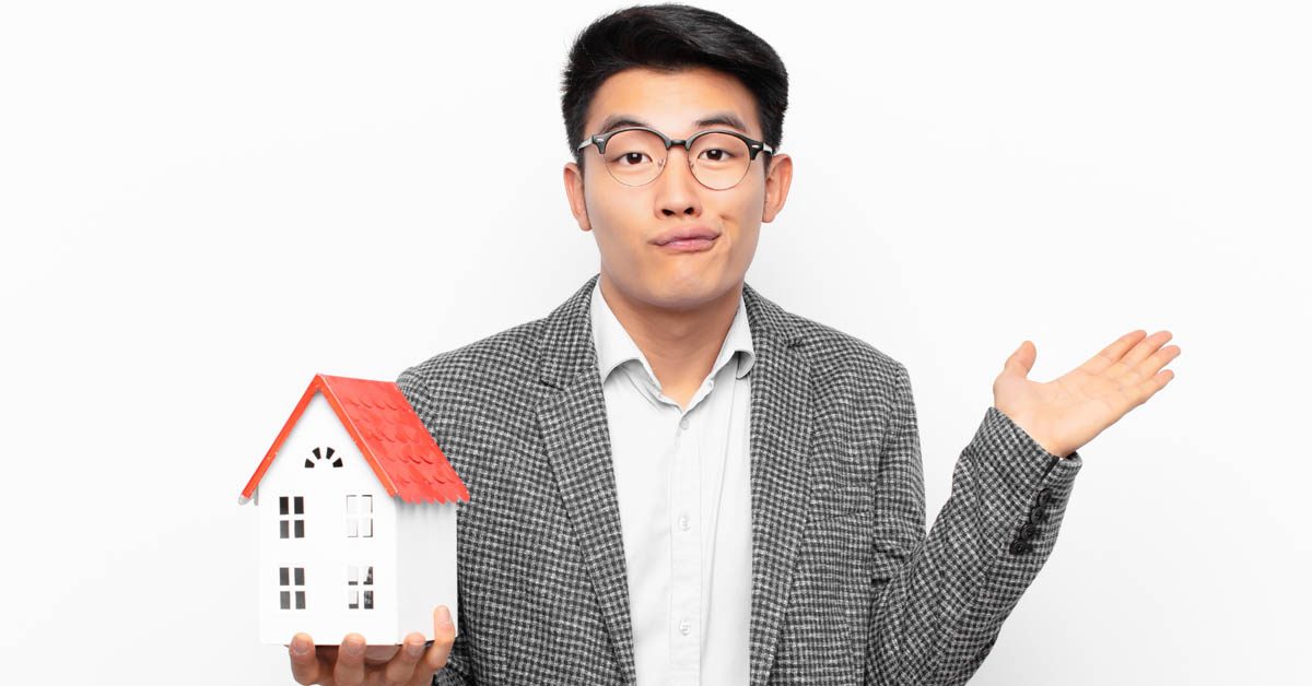 PEOPLE Man in glasses confused by house