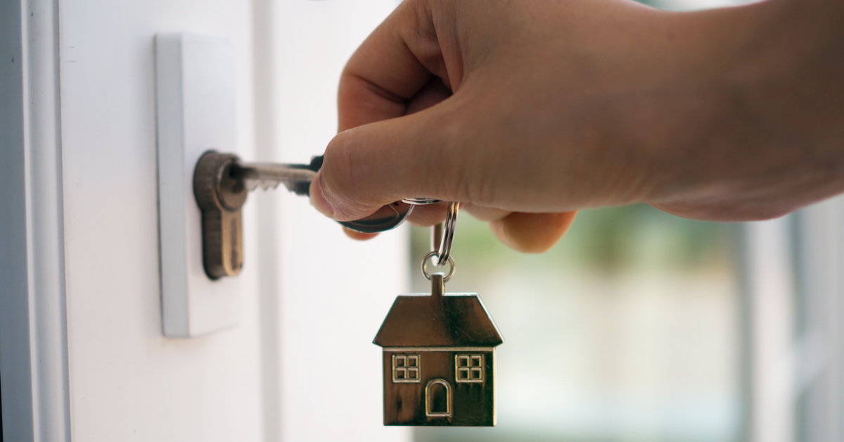 CONCEPT Key unlocking door to new home