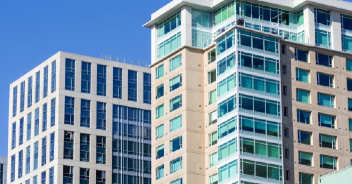 Exterior,View,Of,Multifamily,Residential,Building,,Next,To,An,Office