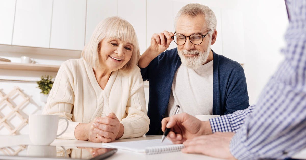PEOPLE Boomer couple looking at documents